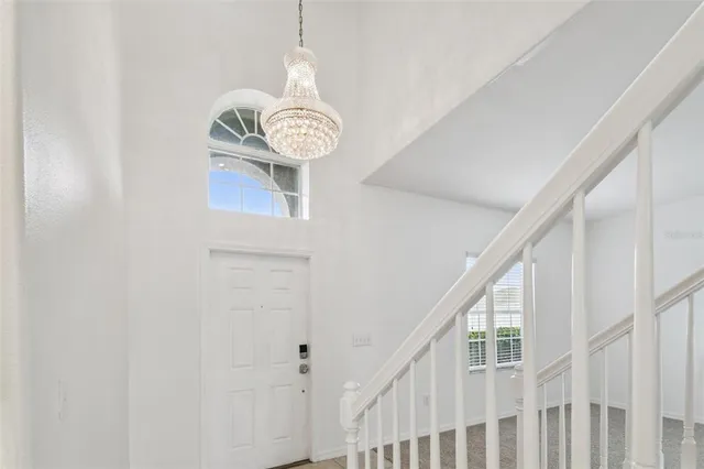 a view of a hallway to a livingroom