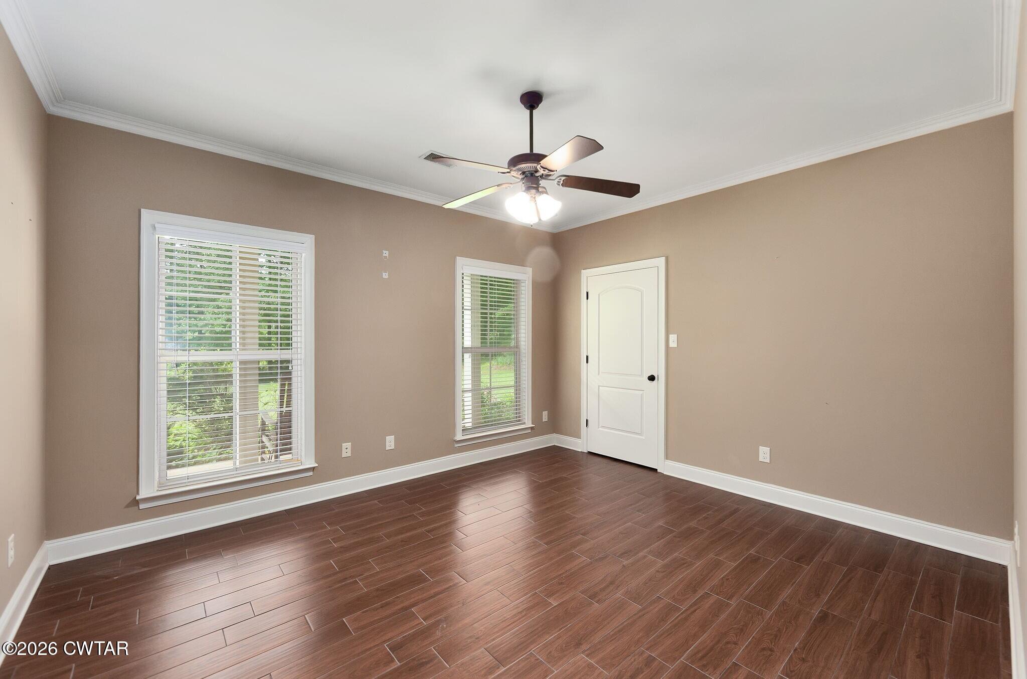 4080 Beech Bluff Road Beech Bluff, TN 38313 - Photo 25 of 41 a view of an empty room with wooden floor and a window