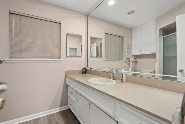 a bathroom with a sink and a mirror