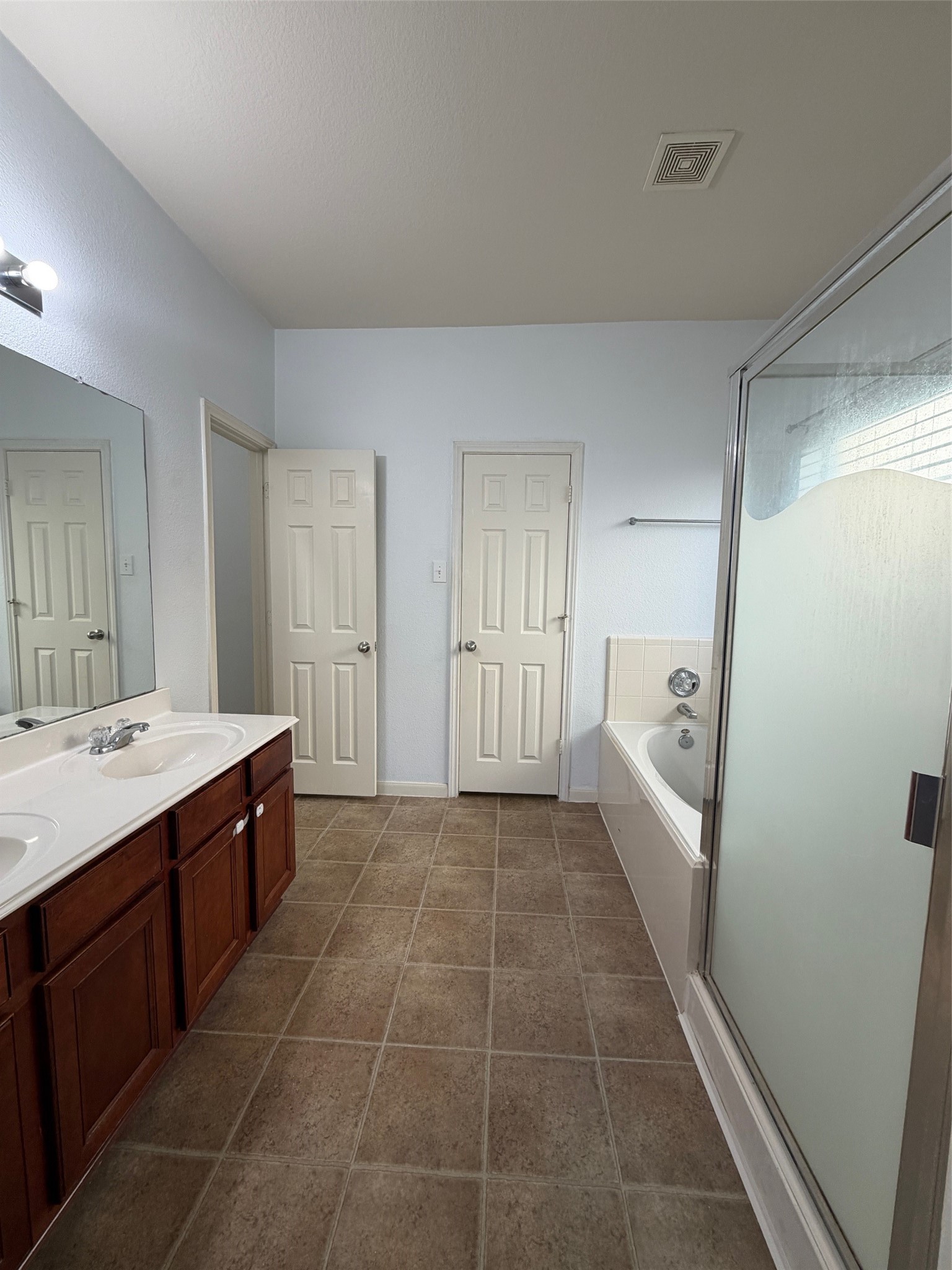 25214 Spring Iris Lane Katy, TX 77494 - Photo 16 of 23 a large bathroom with a tub sink and mirror