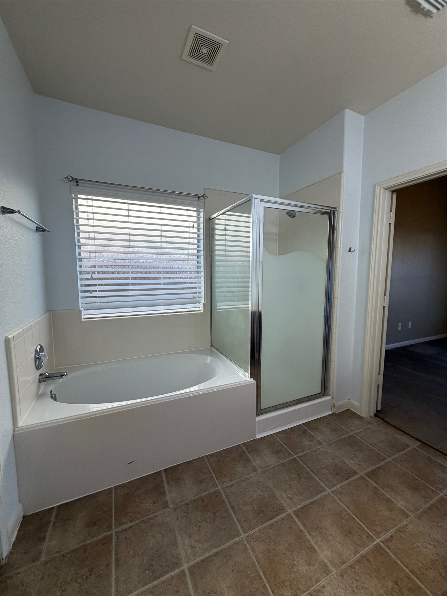 25214 Spring Iris Lane Katy, TX 77494 - Photo 17 of 23 a bathroom with a bathtub and a shower