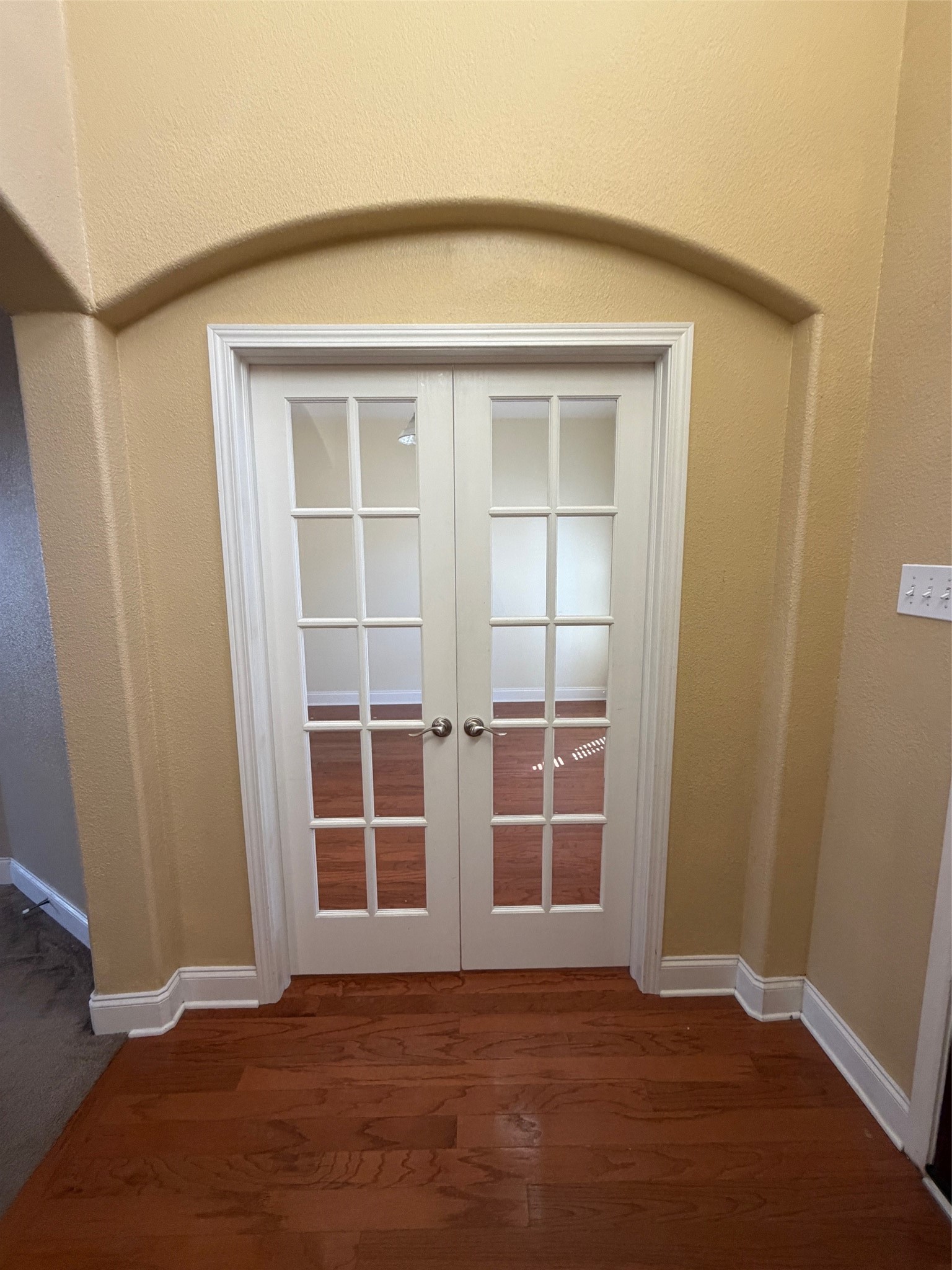 25214 Spring Iris Lane Katy, TX 77494 - Photo 4 of 23 an empty room with wooden floor and windows