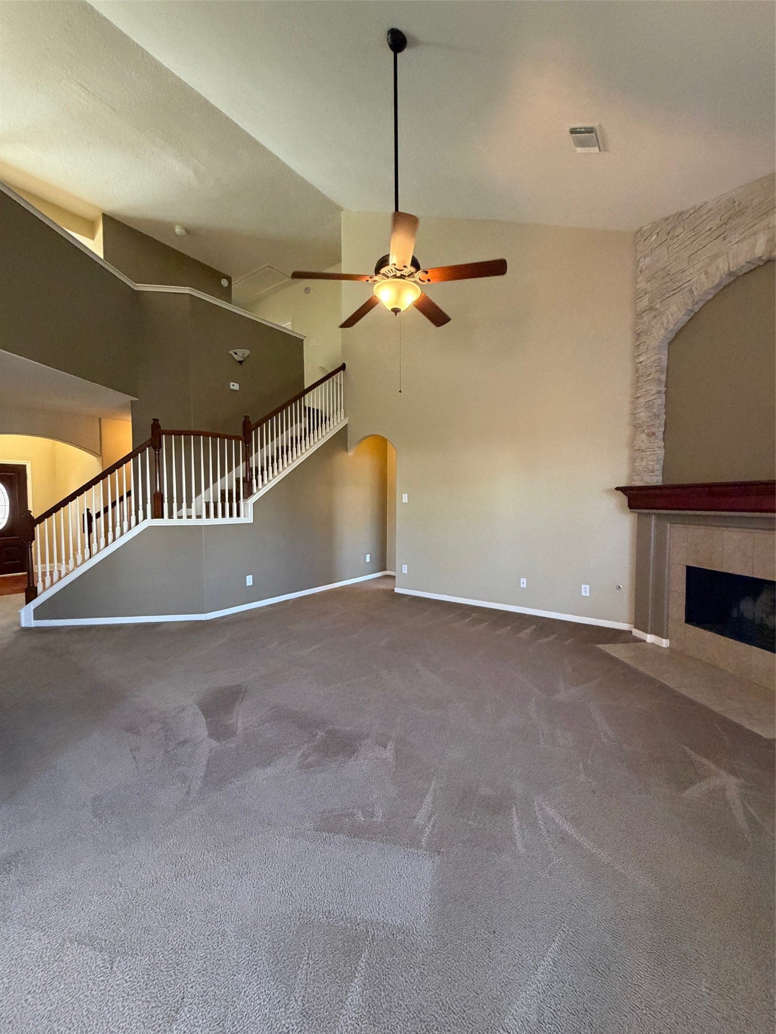 25214 Spring Iris Lane Katy, TX 77494 - Photo 5 of 23 a view of an empty room with a fireplace