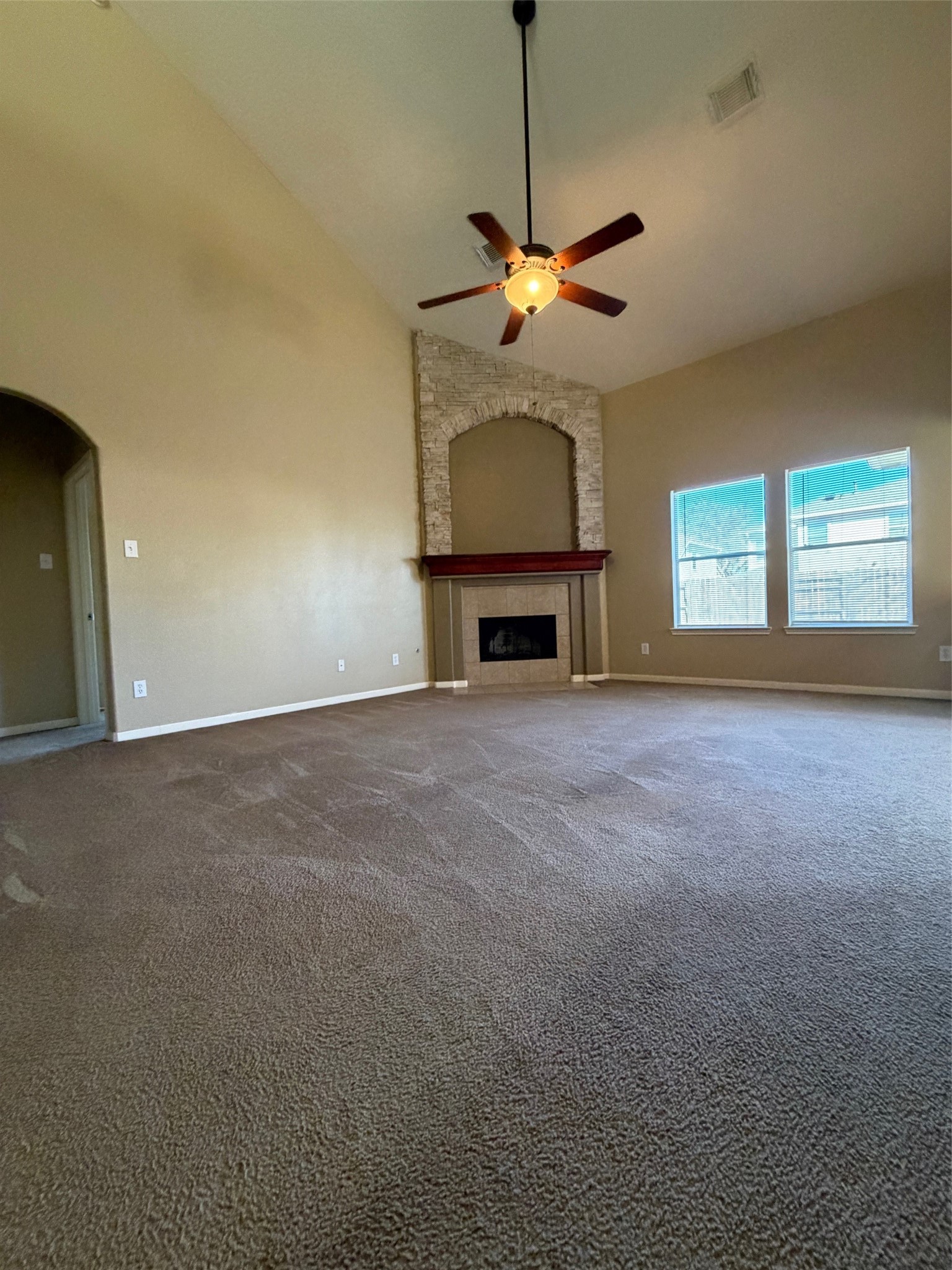 25214 Spring Iris Lane Katy, TX 77494 - Photo 8 of 23 a view of empty room with fan and windows
