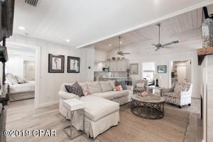 13007 Oleander Drive Panama City Beach, FL 32407 - Photo 2 of 7 a living room with furniture and a large window