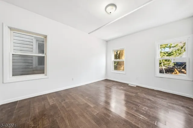 a kitchen with stainless steel appliances granite countertop lots of white cabinets