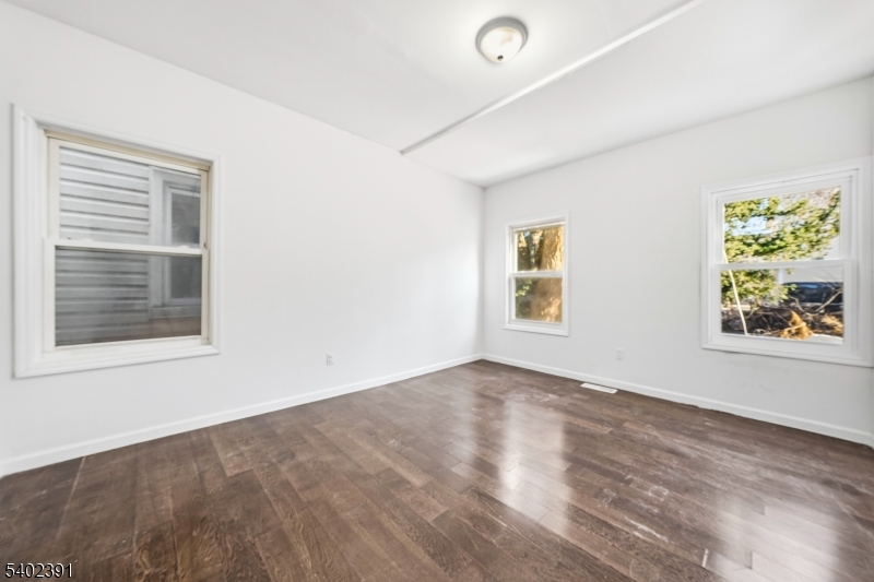 152 South 10th Street Newark, NJ 07107 - Photo 16 of 21 an empty room with windows