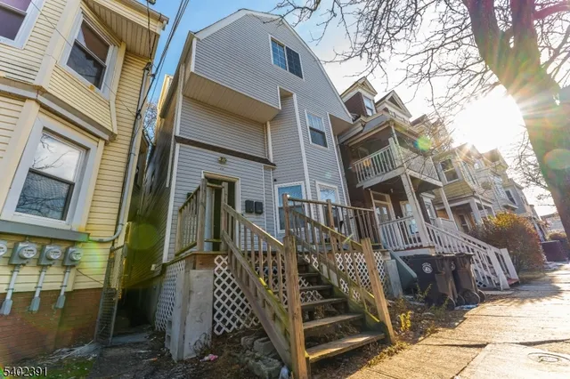 a view of a kitchen with a sink and cabinets