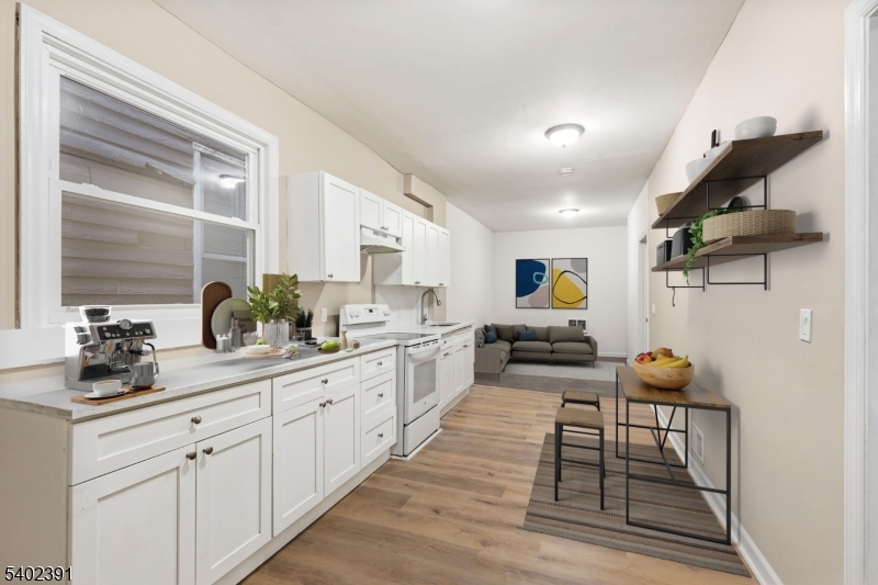 152 South 10th Street Newark, NJ 07107 - Photo 4 of 21 a kitchen with sink and cabinets