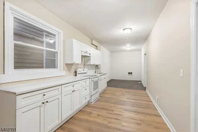 a bathroom with a toilet sink and shower
