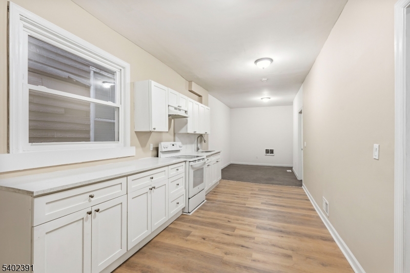 152 South 10th Street Newark, NJ 07107 - Photo 8 of 21 a bathroom with a sink and a mirror