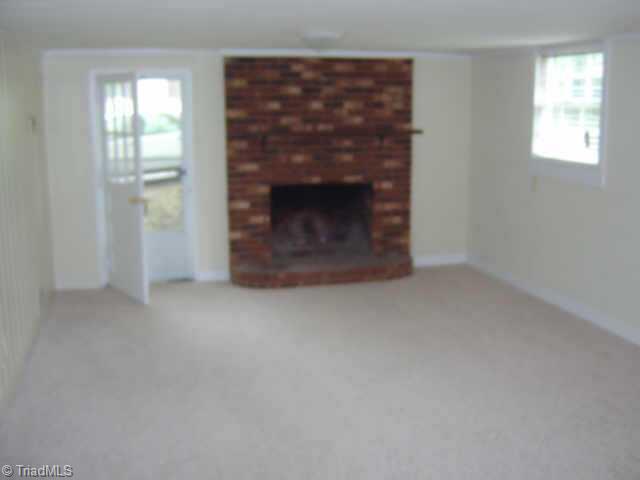 750 Lacock Avenue Rural Hall, NC 27045 - Photo 3 of 6 Other. Lower level playroom with fireplace.