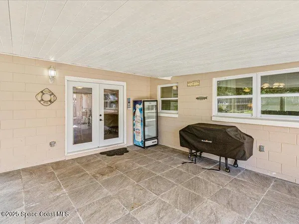 a bedroom with a bed and cabinets
