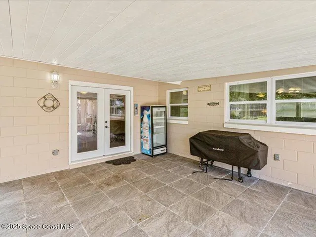 a bedroom with a bed and cabinets