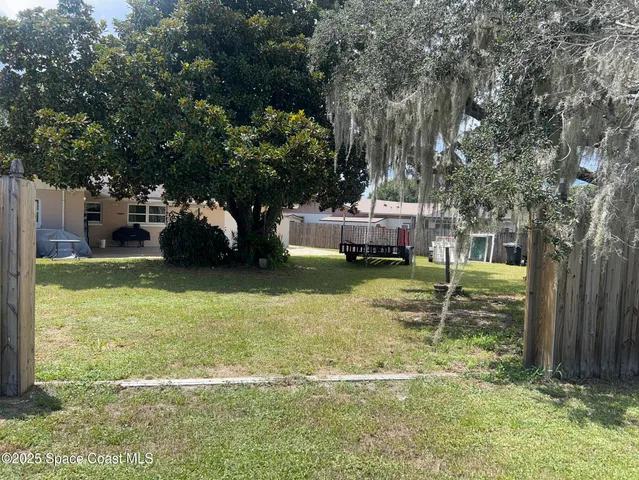 a view of a garden with a slide