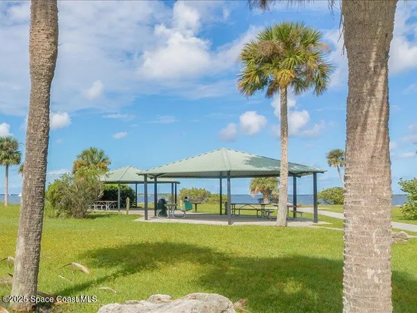 a swimming pool with outdoor seating yard and barbeque oven