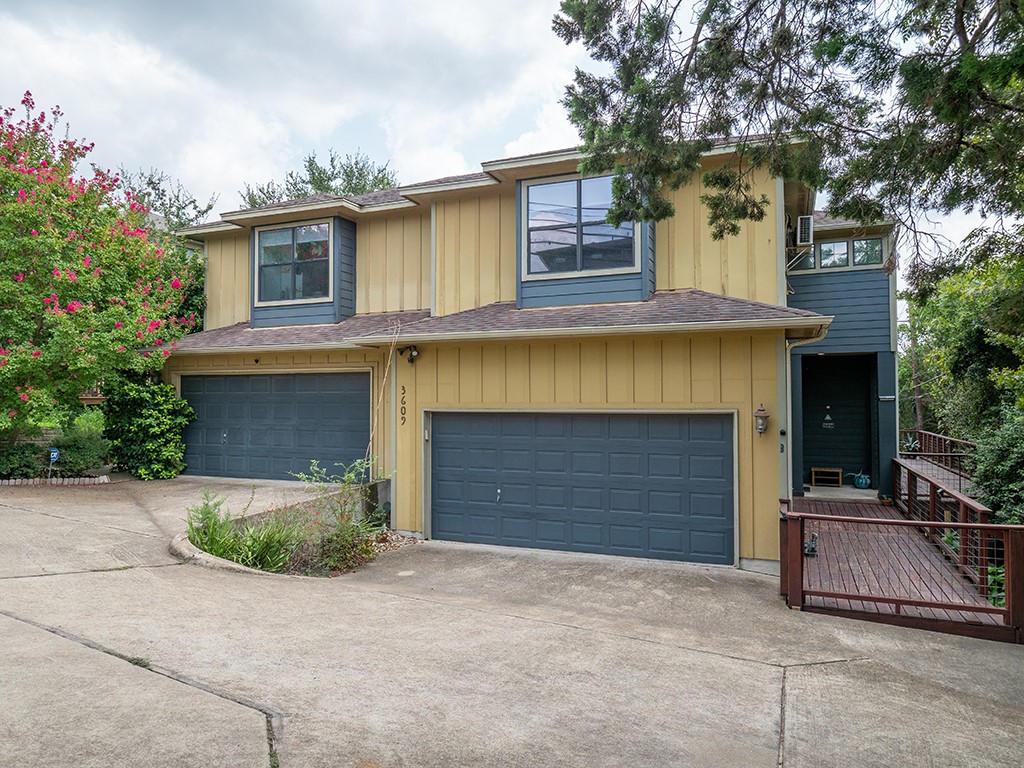 3609 Clawson Road, Unit B Austin, TX 78704 - Photo 2 of 28 Multi-level property exterior with light yellow siding and blue accents