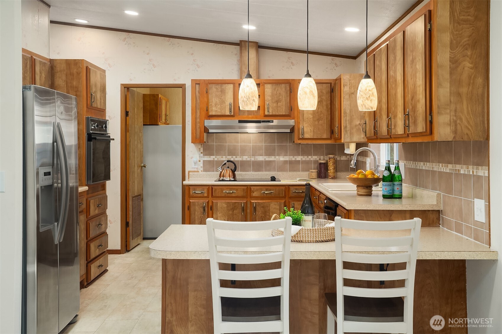 23632 9th Place West Bothell, WA 98021 - Photo 10 of 39 a kitchen with a refrigerator and countertop
