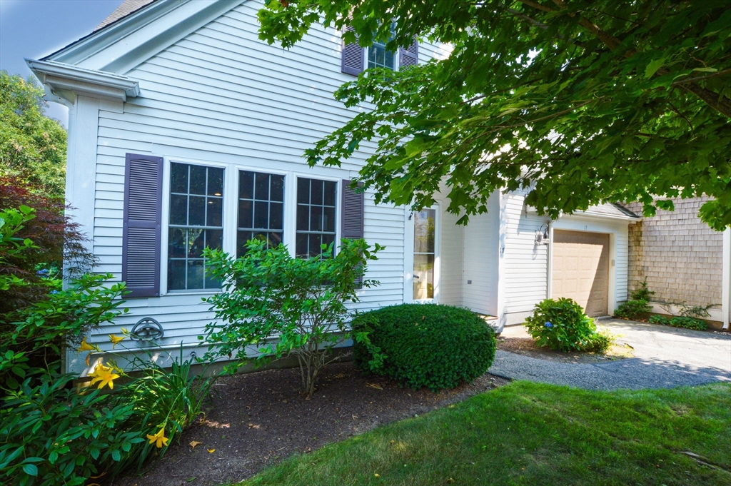 17 Stratford Ridge, Unit 17 Mashpee, MA 02649 - Photo 1 of 24 a view of a house with a yard and plants