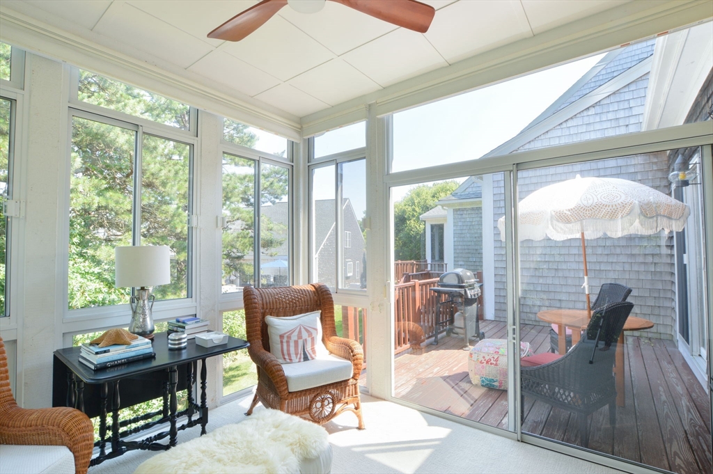 17 Stratford Ridge, Unit 17 Mashpee, MA 02649 - Photo 12 of 24 a living room with furniture and a floor to ceiling window