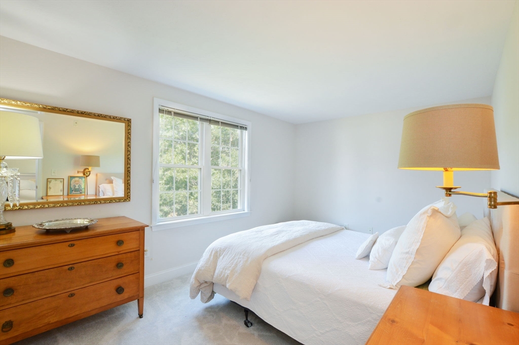 17 Stratford Ridge, Unit 17 Mashpee, MA 02649 - Photo 21 of 24 a bedroom with a bed and a window