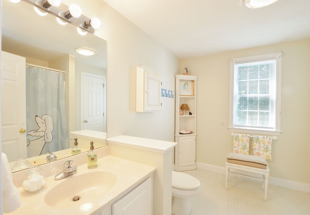 17 Stratford Ridge, Unit 17 Mashpee, MA 02649 - Photo 23 of 24 a bathroom with a sink a toilet and shower