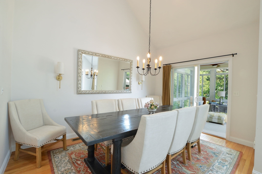 17 Stratford Ridge, Unit 17 Mashpee, MA 02649 - Photo 10 of 24 a view of a dining room with furniture window and wooden floor