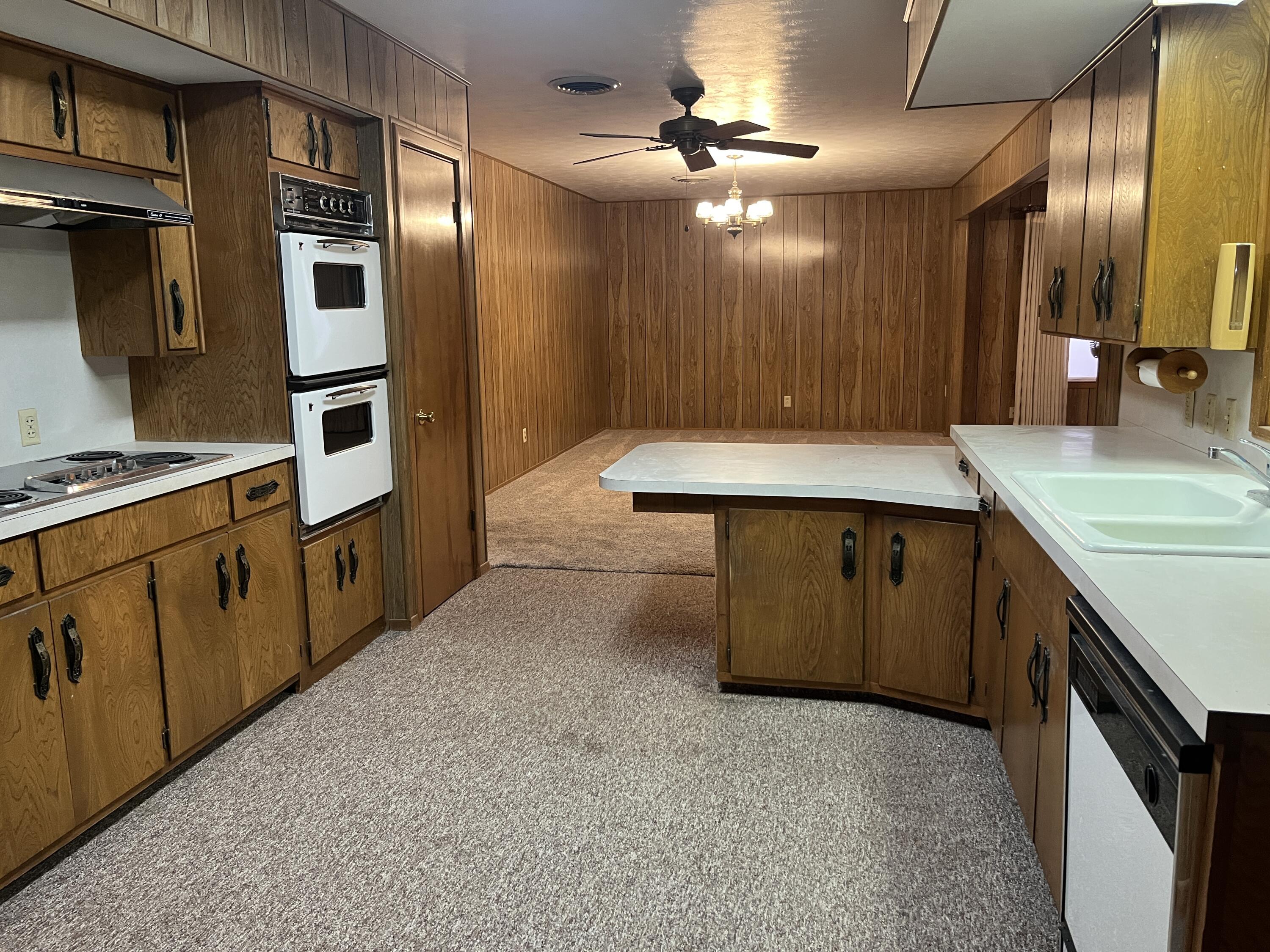 404 North 21st Street Lamesa, TX 79331 - Photo 11 of 29 a kitchen with stainless steel appliances granite countertop a sink and a refrigerator