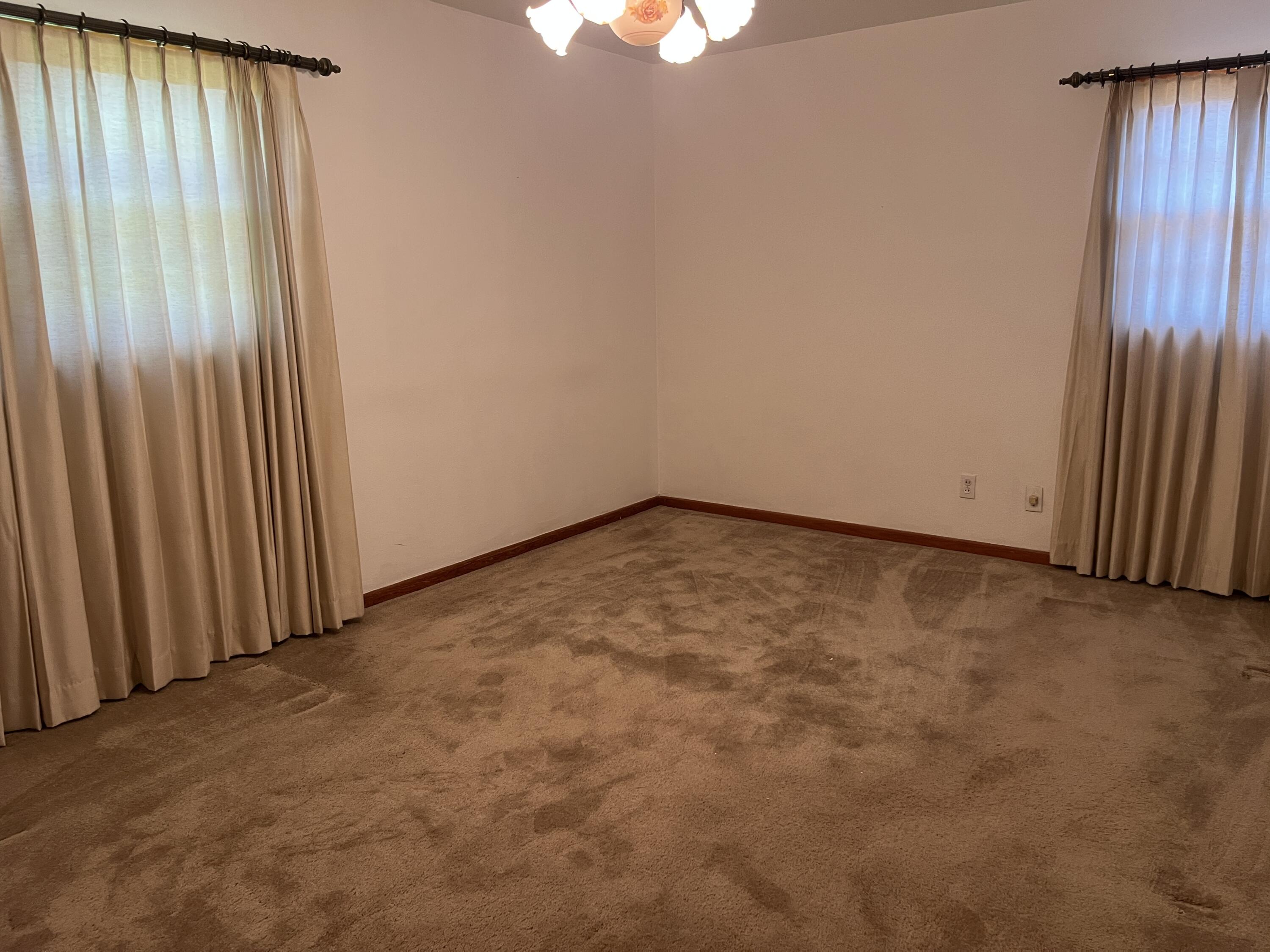 404 North 21st Street Lamesa, TX 79331 - Photo 13 of 29 an empty room with a window