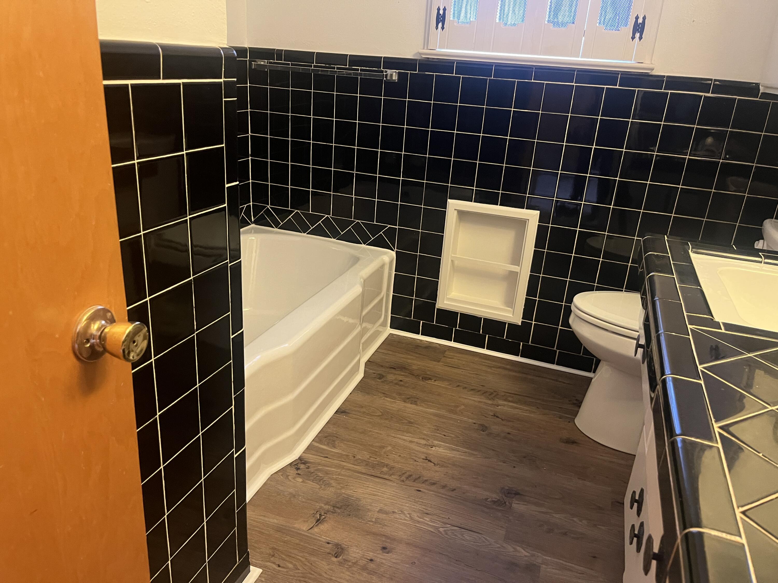 404 North 21st Street Lamesa, TX 79331 - Photo 18 of 29 a bathroom with a toilet and a sink