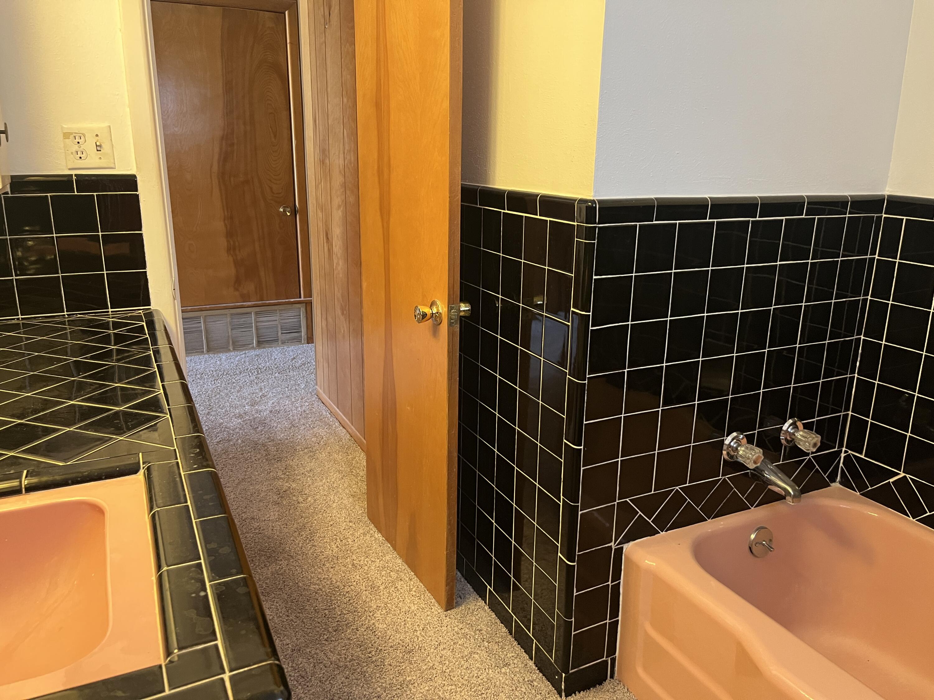 404 North 21st Street Lamesa, TX 79331 - Photo 21 of 30 a bathroom with a bathtub and a shower