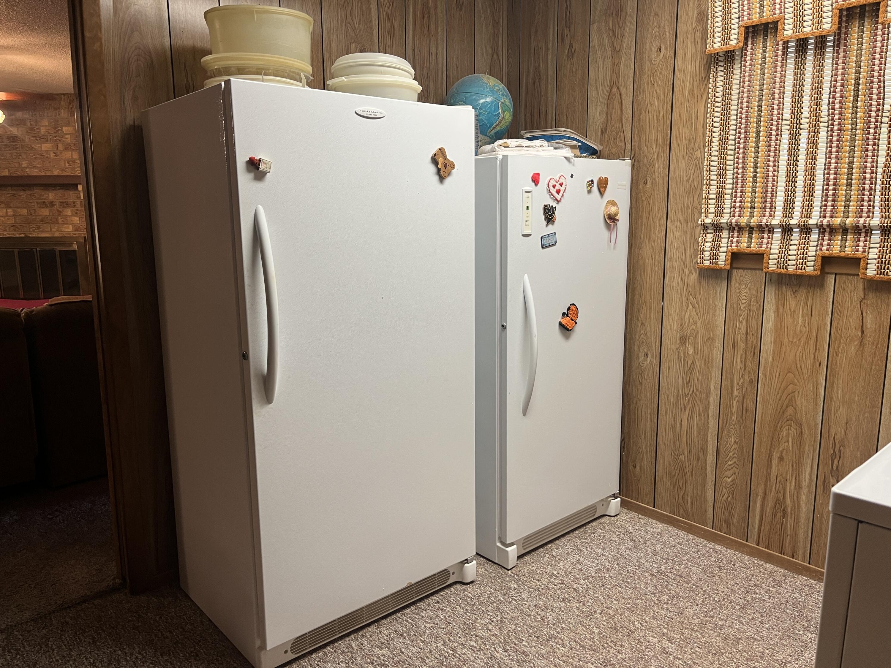 404 North 21st Street Lamesa, TX 79331 - Photo 23 of 29 a white refrigerator freezer sitting inside of a kitchen
