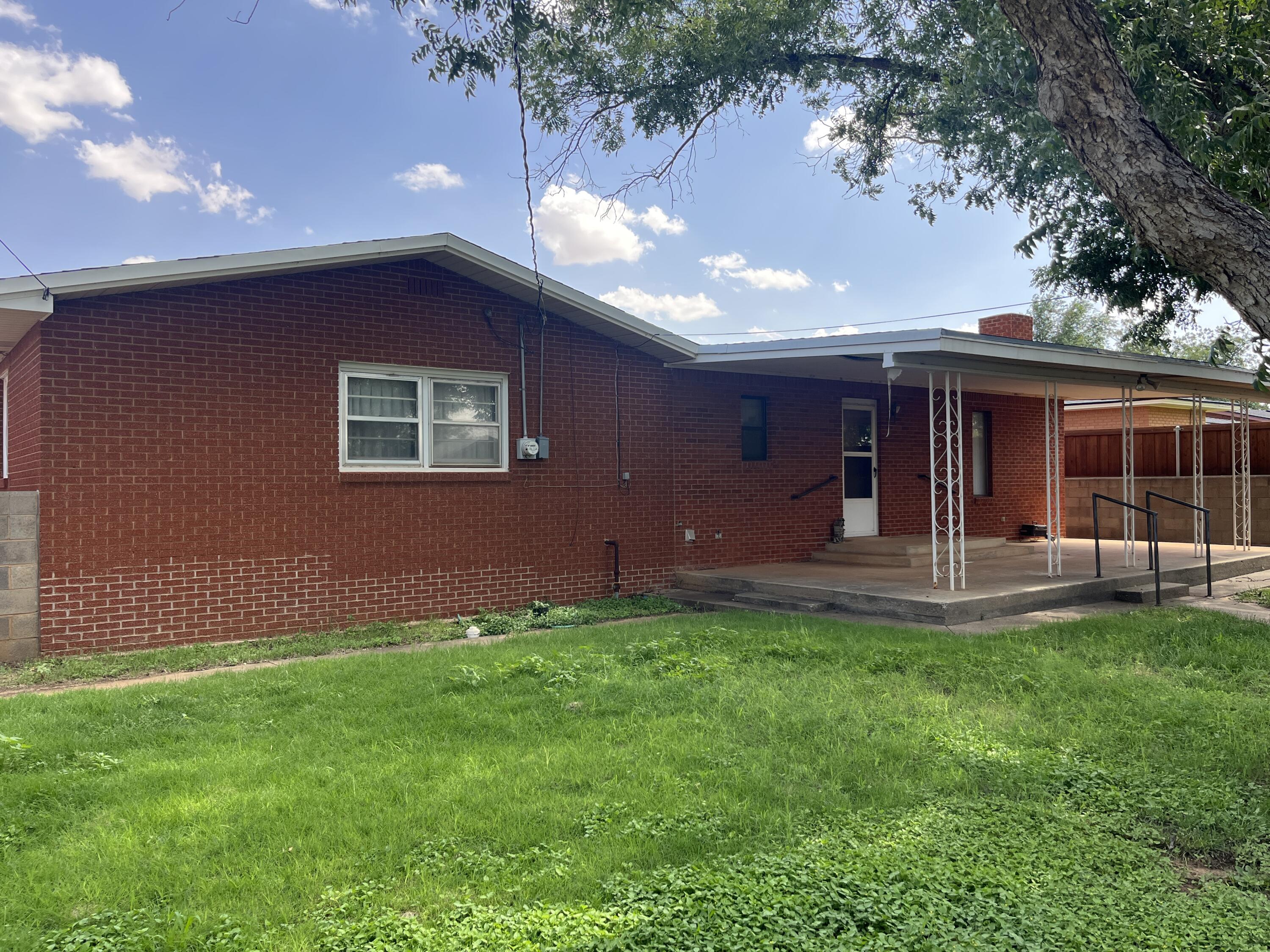 404 North 21st Street Lamesa, TX 79331 - Photo 28 of 30 a view of a house with a backyard porch and sitting area