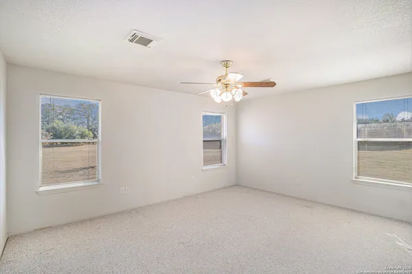 a view of empty room with windows