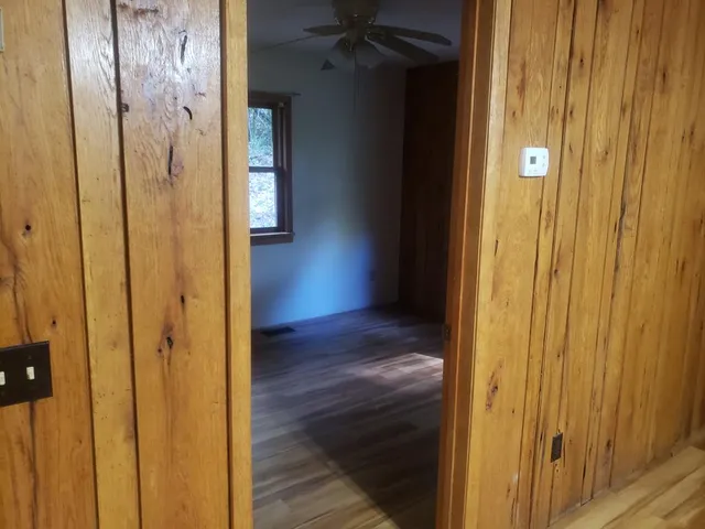 a backyard of a house with lots of green space