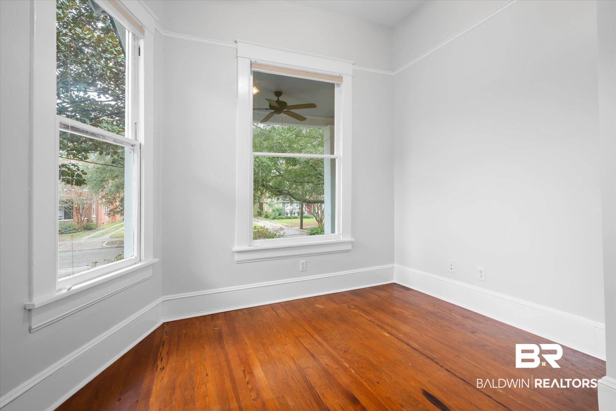 14 South Monterey Street Mobile, AL 36604 - Photo 30 of 41 Spare room with hardwood / wood-style floors, a wealth of natural light, and ceiling fan