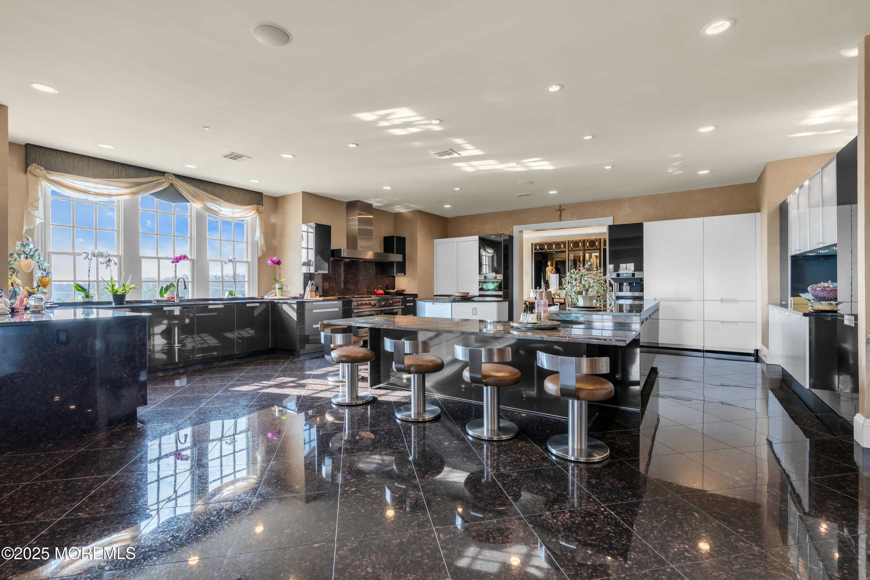 1041 Oval Road Manasquan, NJ 08736 - Photo 12 of 30 a kitchen with lots of counter top space a sink appliances and cabinets