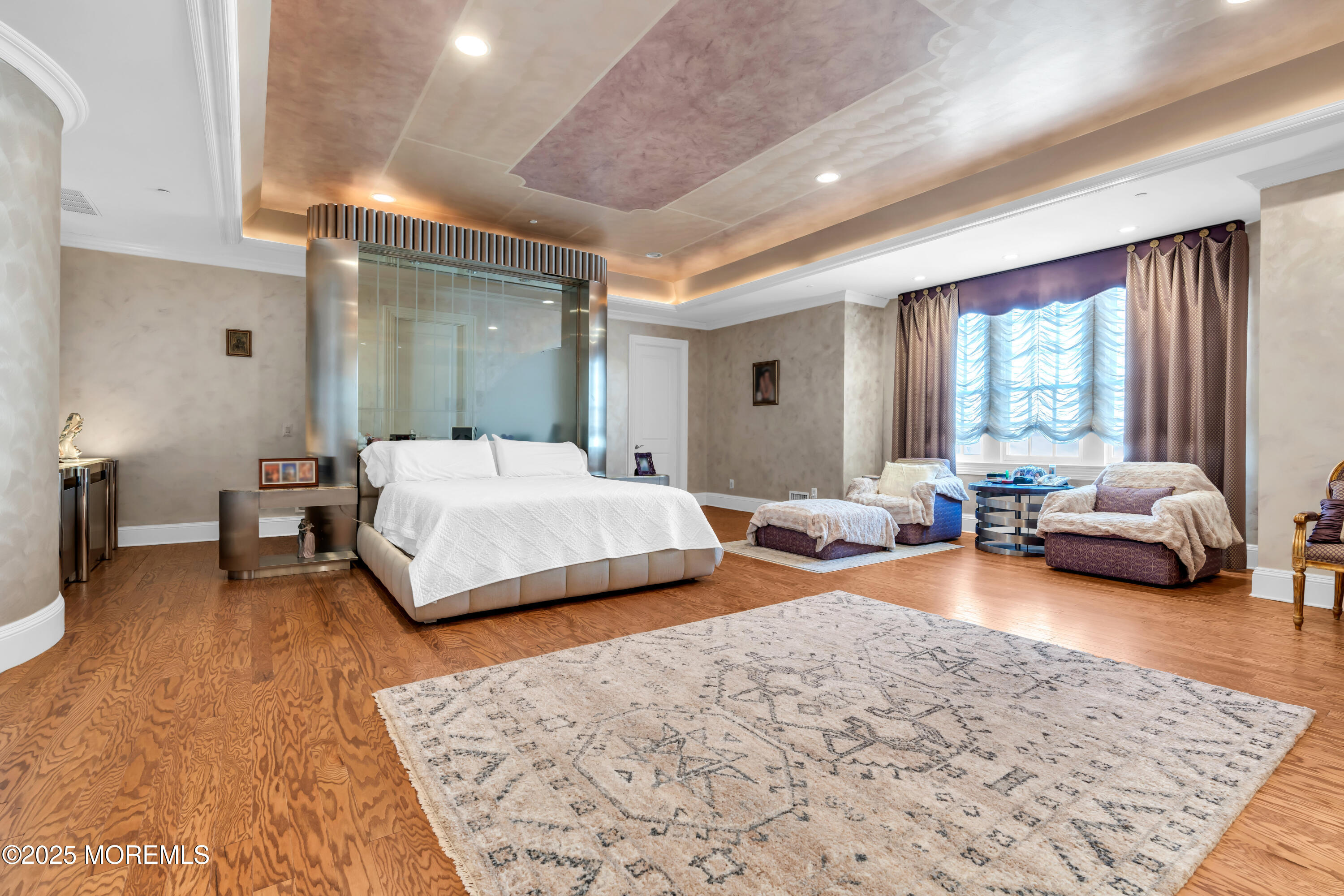 1041 Oval Road Manasquan, NJ 08736 - Photo 22 of 30 a bedroom with a bed couch and a large window