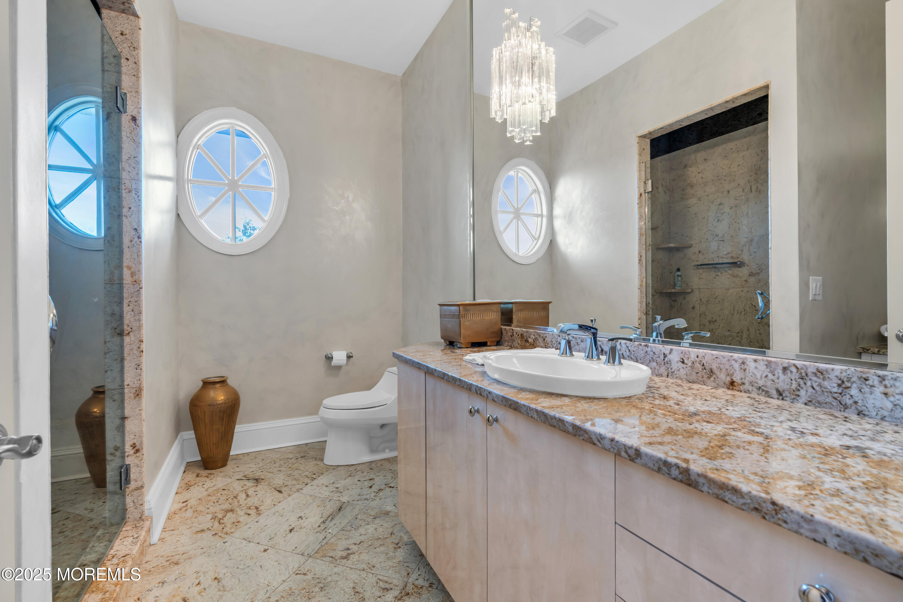 1041 Oval Road Manasquan, NJ 08736 - Photo 25 of 30 a bathroom with a granite countertop toilet a sink and a mirror