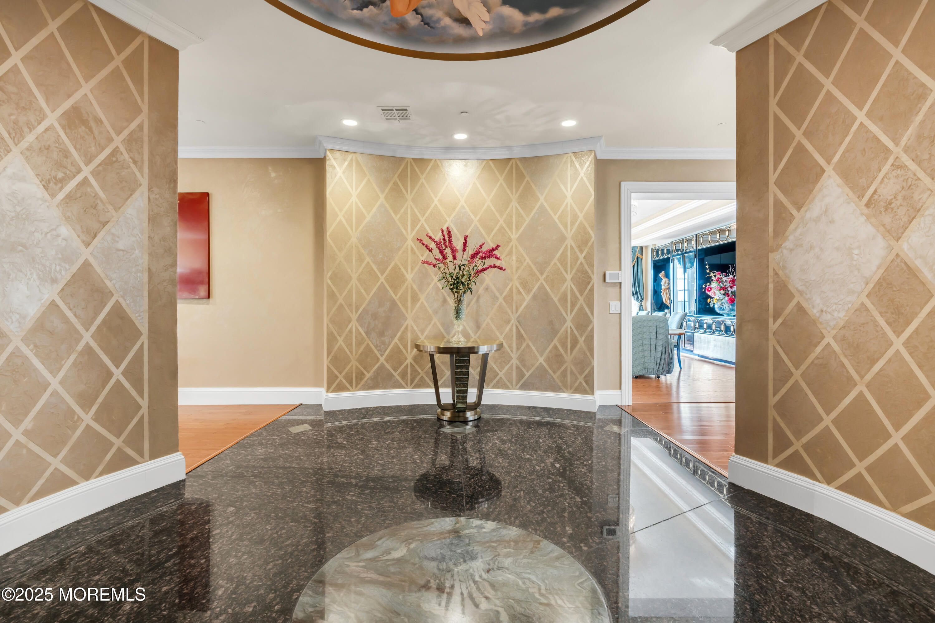 1041 Oval Road Manasquan, NJ 08736 - Photo 4 of 30 a view of a hallway with wooden floor and a potted plant