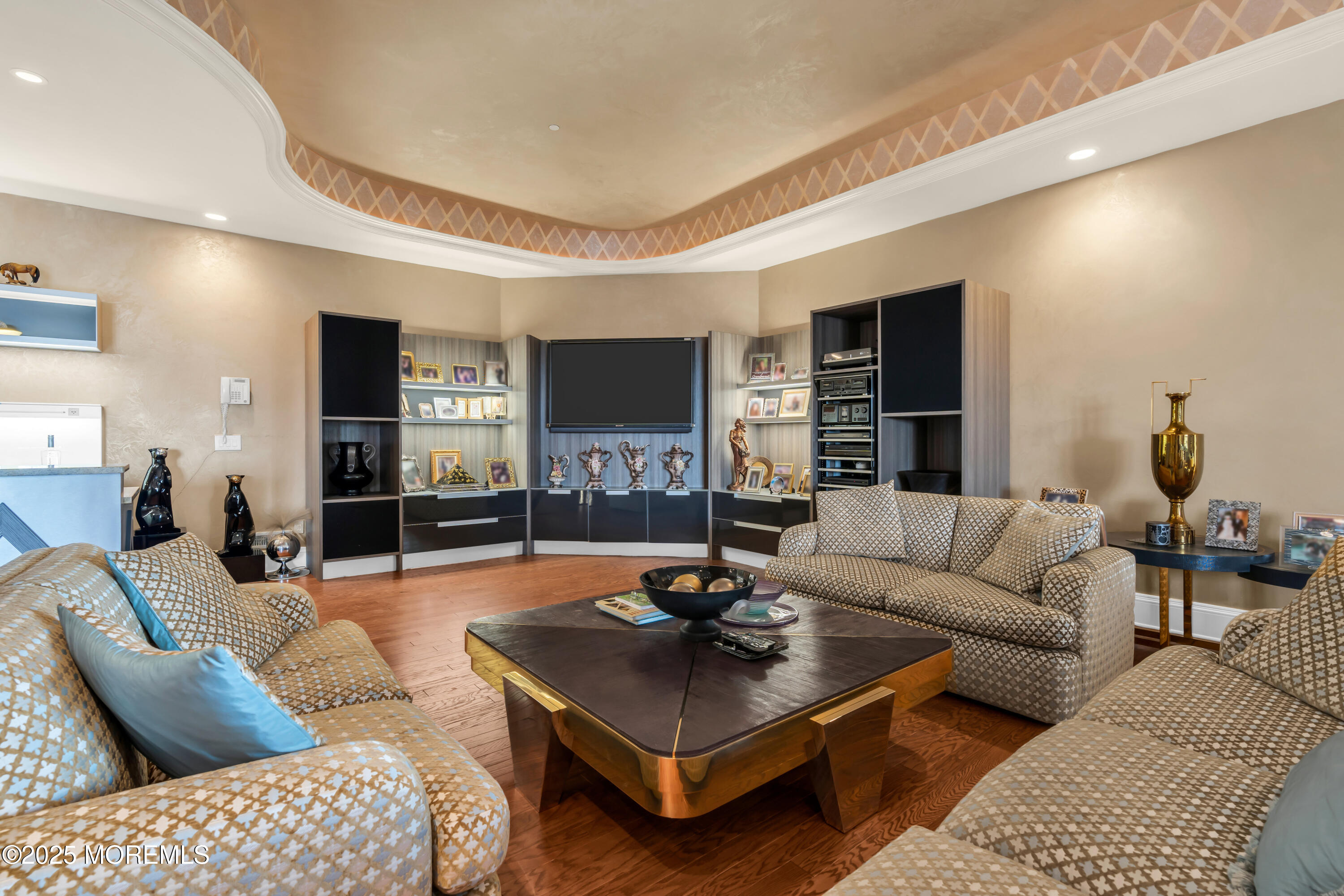 1041 Oval Road Manasquan, NJ 08736 - Photo 9 of 30 a living room with furniture a flat screen tv and kitchen view