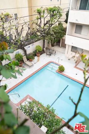 a view of a swimming pool with a yard