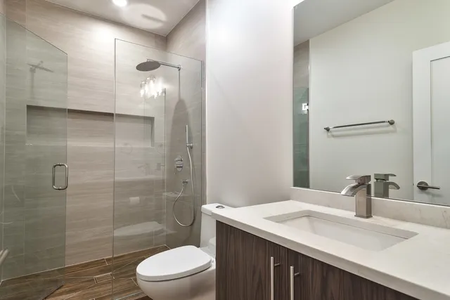 a view of kitchen with stainless steel appliances kitchen island granite countertop a stove top oven a sink and dishwasher