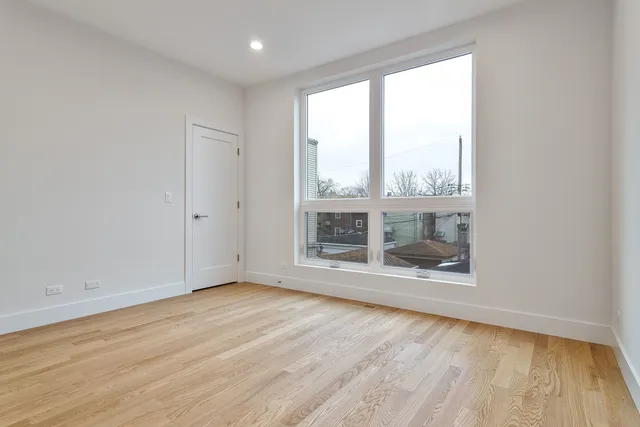 a view of an empty room with windows