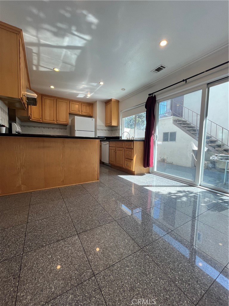 17401 Appalachian Street Fountain Valley, CA 92708 - Photo 11 of 23 a view of a living room with a large window