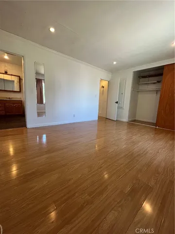 a view of a livingroom with wooden floor