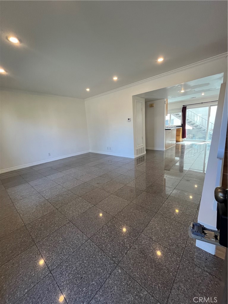 17401 Appalachian Street Fountain Valley, CA 92708 - Photo 5 of 23 an empty room with wooden floor and windows