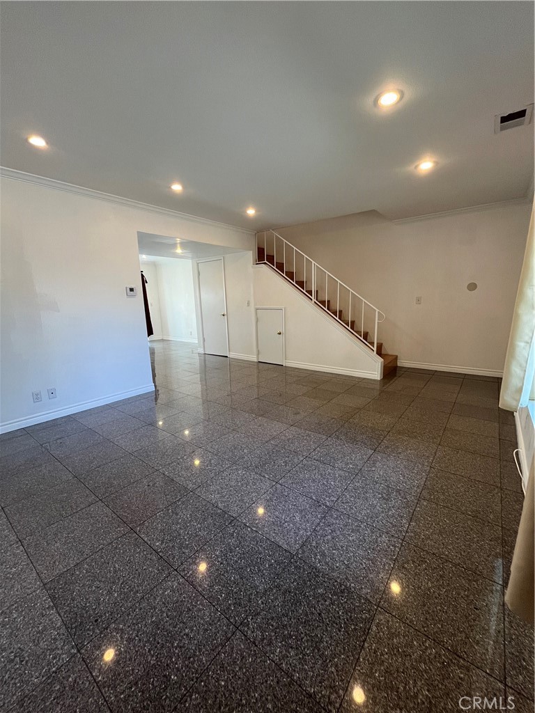 17401 Appalachian Street Fountain Valley, CA 92708 - Photo 7 of 23 a view of an empty room with wooden floor