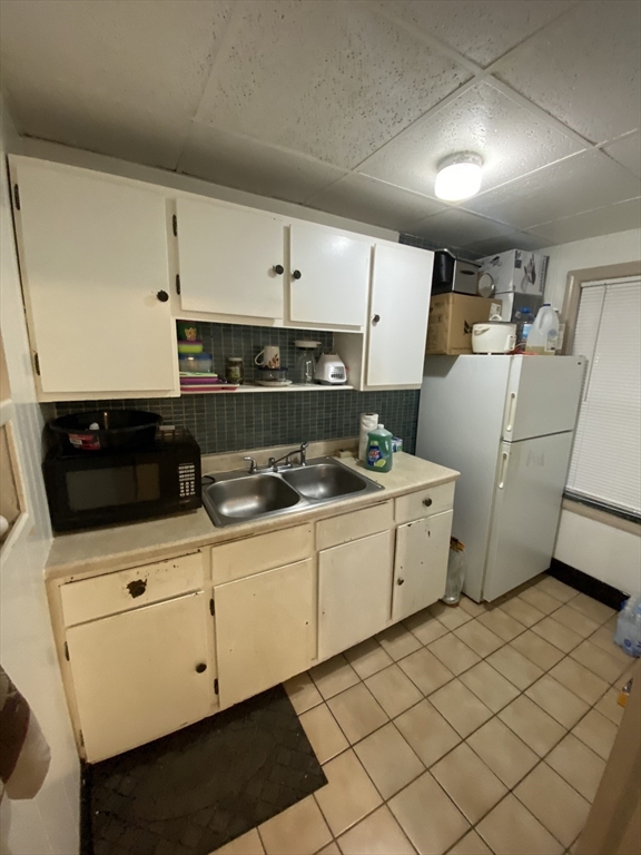 9 Fifth Avenue Worcester, MA 01607 - Photo 11 of 41 a kitchen with a sink a stove and cabinets