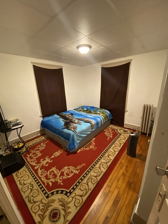 9 Fifth Avenue Worcester, MA 01607 - Photo 13 of 41 a bedroom with a bed and dresser